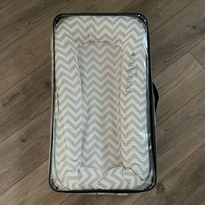 Dockatot like new, still in packaging.  Baby tried it once and didn’t like it.